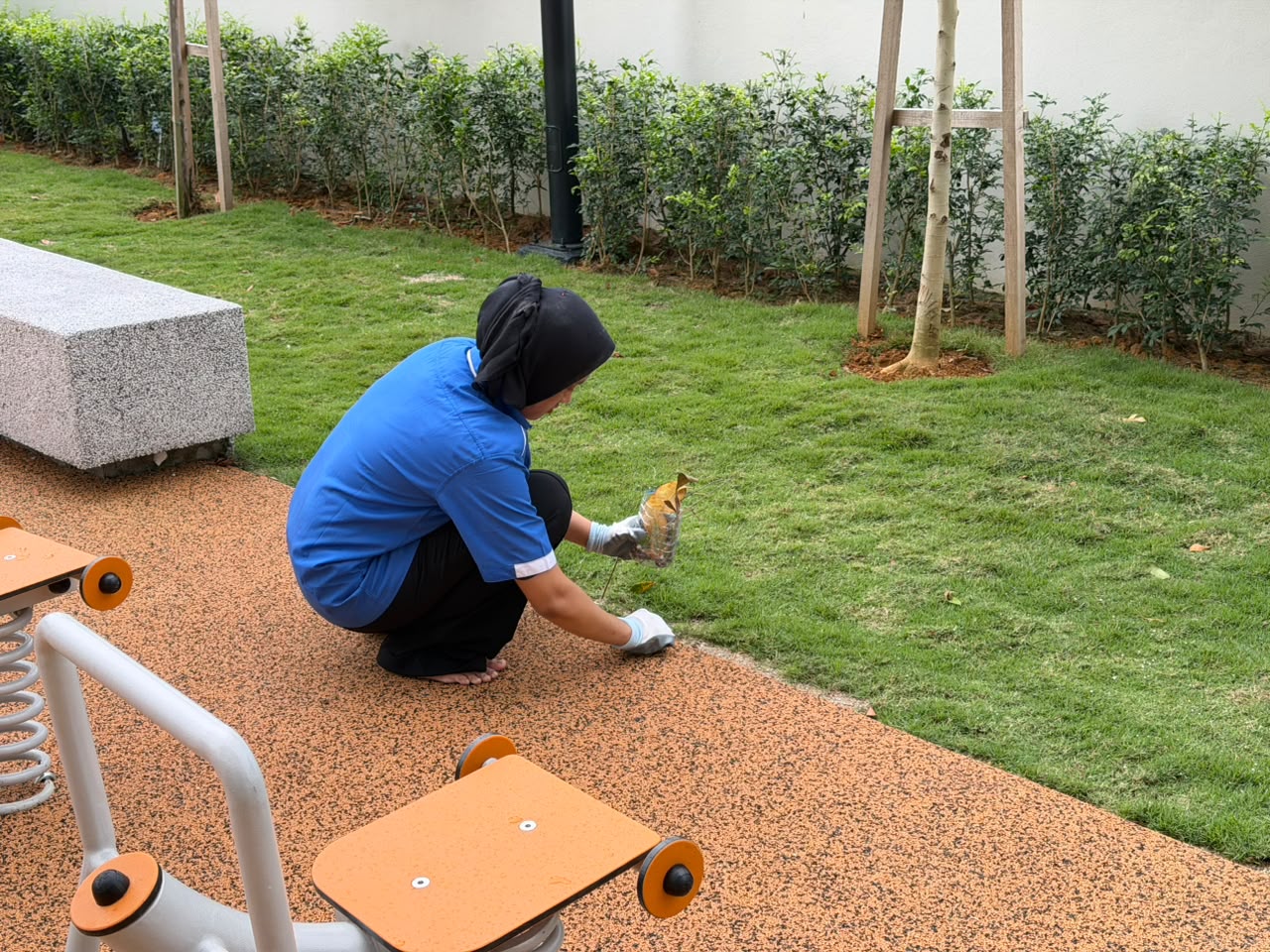 CSC Services crew member tending a landscaped area